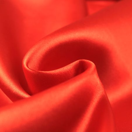 Tissus satin polyester orange perlé